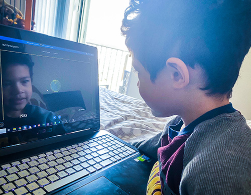 Photo of young boy engaged in online STEM learning