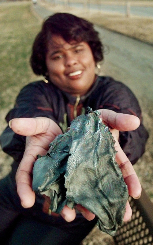 Ms. Lottie Williams holds space debris