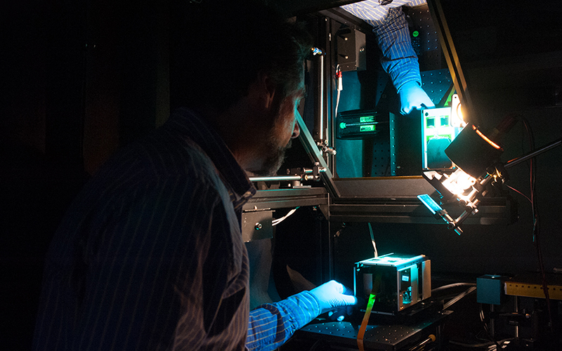 Aerospace scientist tests an AeroCube