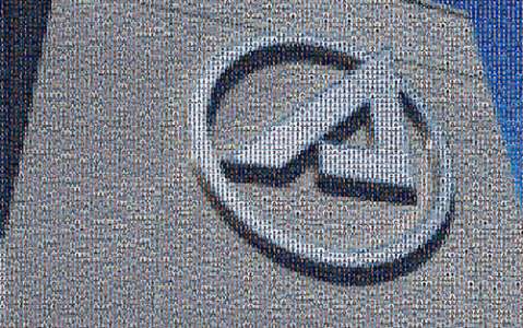 Mosaic of Aerospace employee photos that make up the Circle-A
