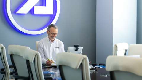 Steve Isakowitz working in a conference room with Circle-A behind him