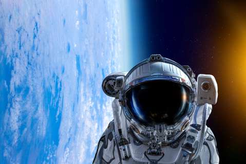 Astronaut in Space over Earth