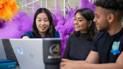 Picture of Aerospace employees looking at graphs on a laptop