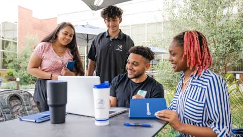 Aerospace employees collaborating outside