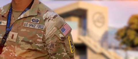 Closeup of a service member's uniform standing outside