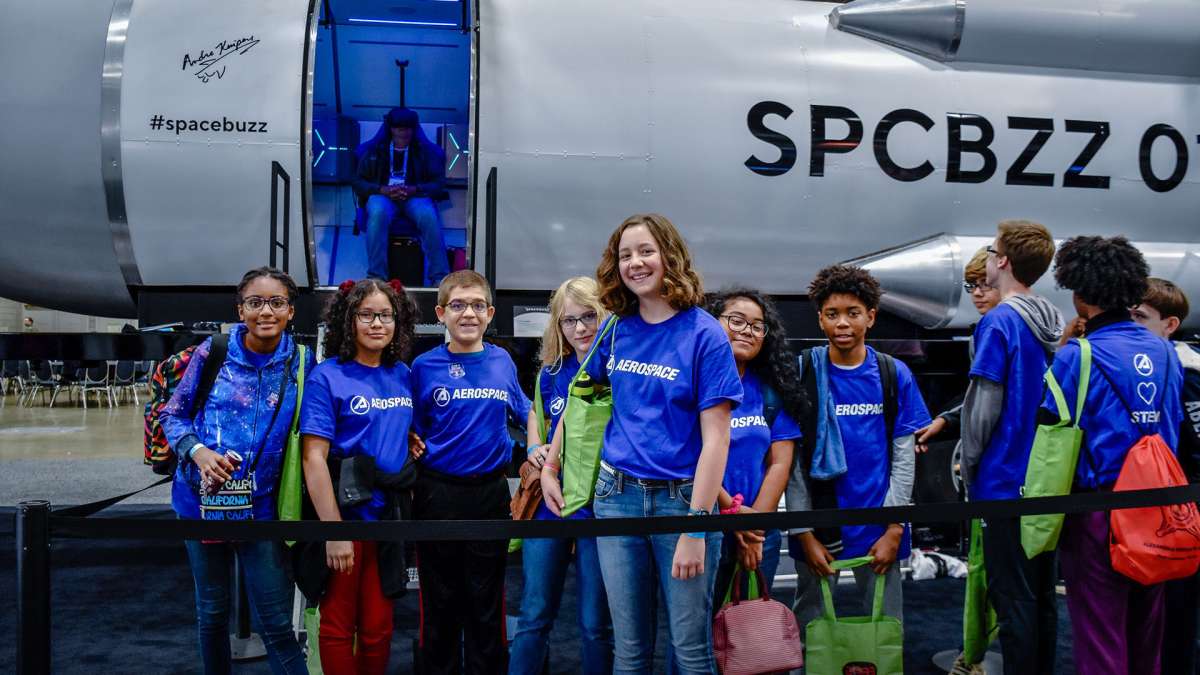 Aerospace employees volunteered to share the wonders of space with STEM students at the International Astronautical Congress.
