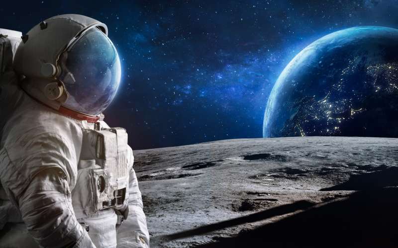 Astronaut on the Moon with Earth in the background