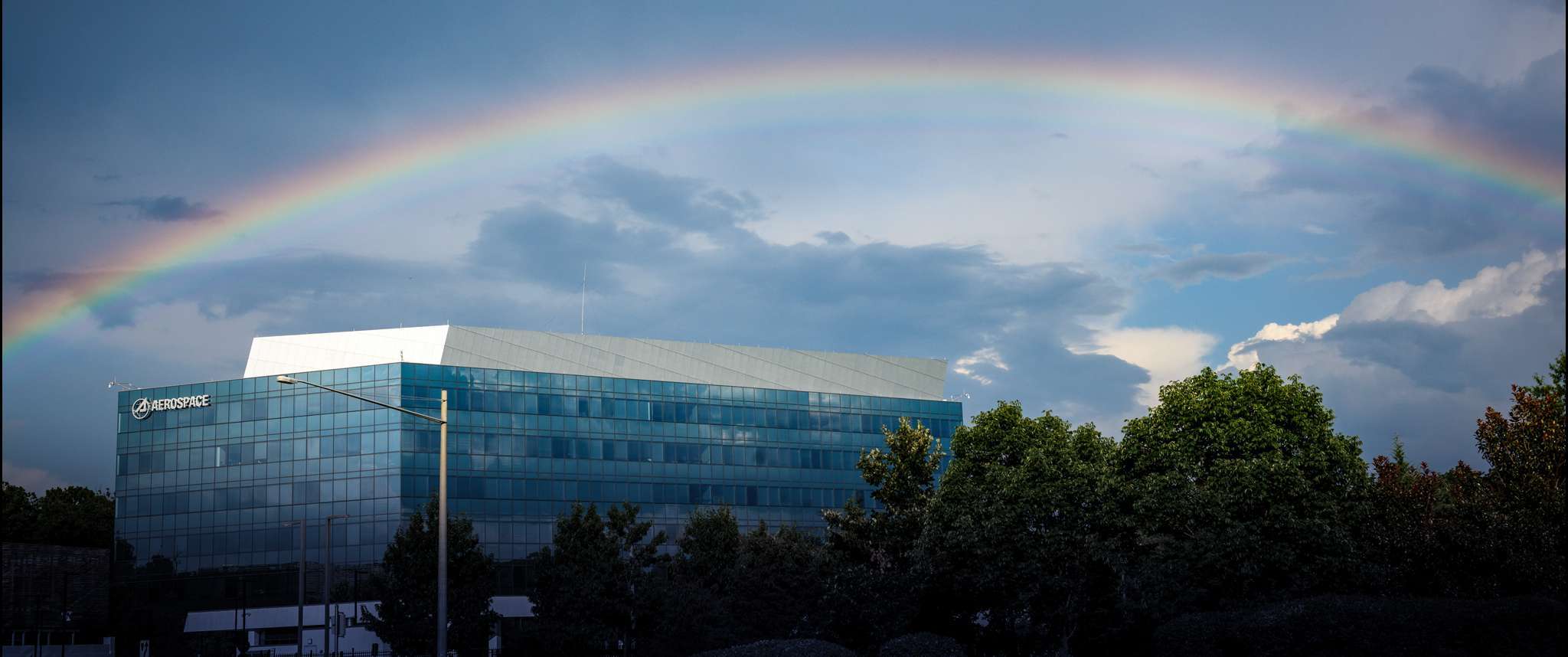 A rainbow appears over Aerospace's Chantilly campus, one of our many nationwide locations where our people work side-by-side each day with government partners to solve the hardest problems for space.