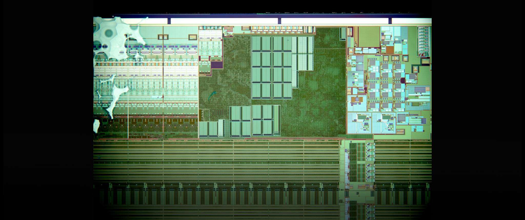 Melting Away the Silicon: A FPGA (Field Programmable Gate Array) chip. The silicon has been chemically etched away, except for upper left corner.