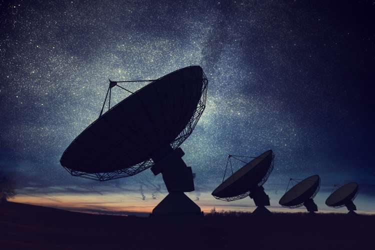AdobeStock_173668395, Silhouettes of satellite dishes or radio antennas against night sky-4500x3000.jpg
