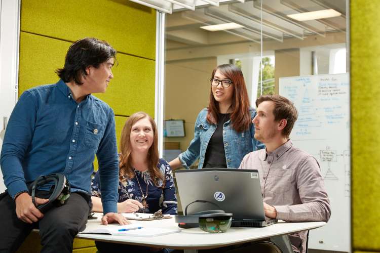 Aerospace employees in a collaboration room