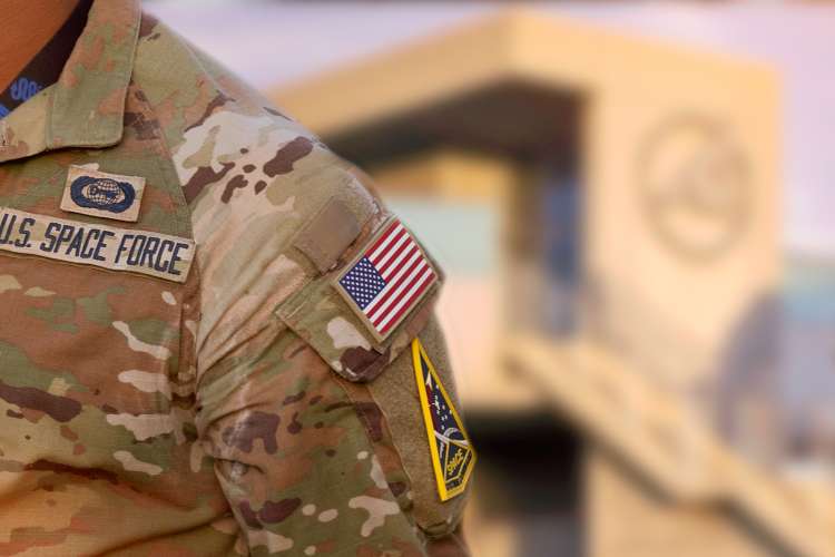 Closeup of a service member's uniform standing outside