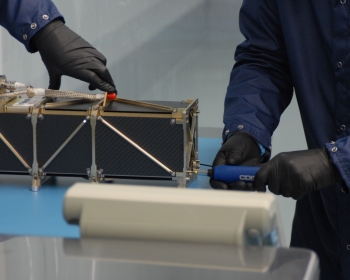 R3 being encapsulated at Rocket Lab's Huntington Beach, Calif. facility.